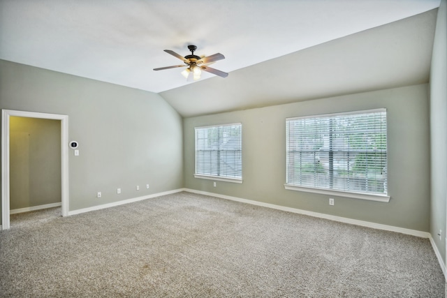 unfurnished room with carpet flooring, lofted ceiling, and ceiling fan