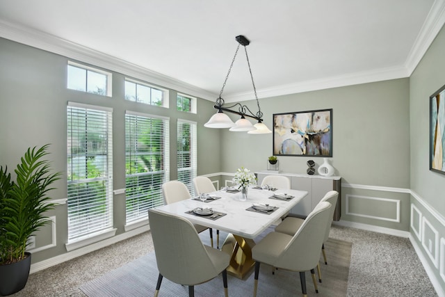 carpeted dining room with crown molding