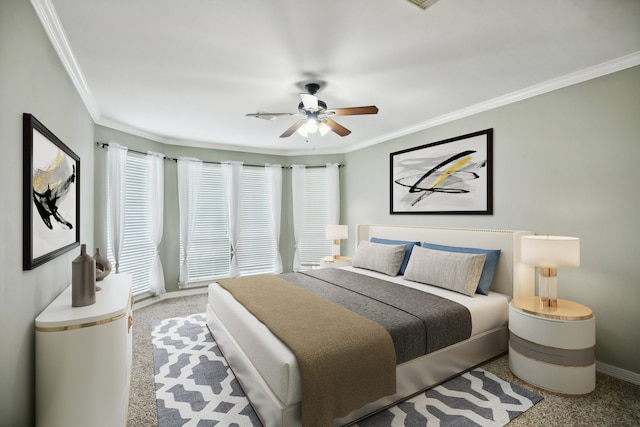 bedroom with crown molding, ceiling fan, and carpet flooring