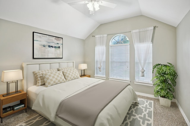 carpeted bedroom with ceiling fan and lofted ceiling