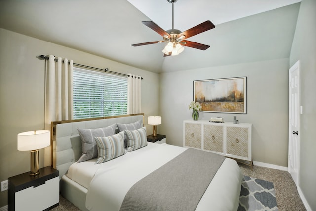 carpeted bedroom with ceiling fan and lofted ceiling