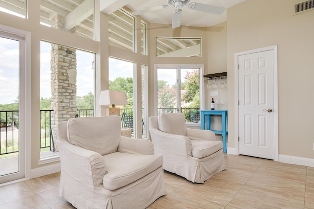 sunroom with vaulted ceiling and ceiling fan