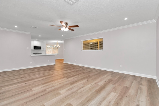 unfurnished living room featuring ornamental molding, a textured ceiling, ceiling fan with notable chandelier, and light wood-type flooring