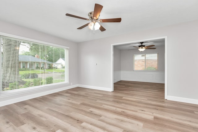 empty room featuring light hardwood / wood-style floors and ceiling fan