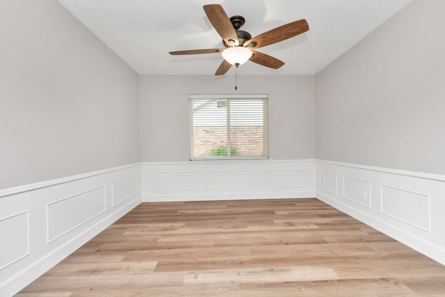 spare room with light hardwood / wood-style floors and ceiling fan