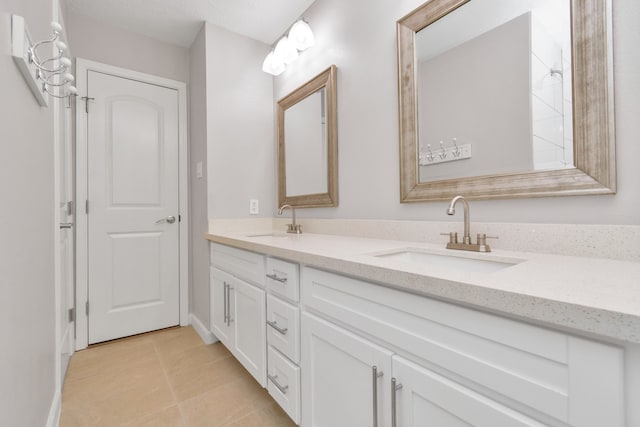 bathroom featuring dual vanity and tile patterned floors