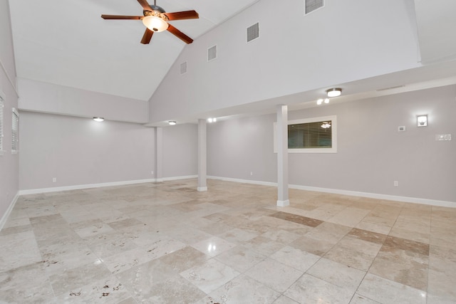 basement featuring ceiling fan and light tile patterned floors