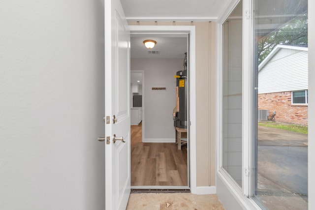 doorway to property featuring cooling unit