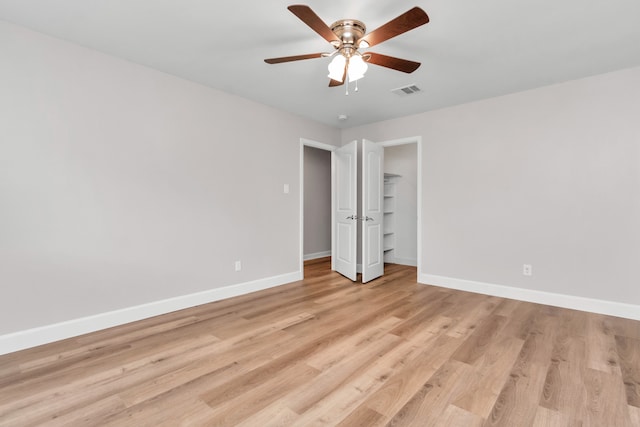 unfurnished bedroom with ceiling fan and light hardwood / wood-style flooring