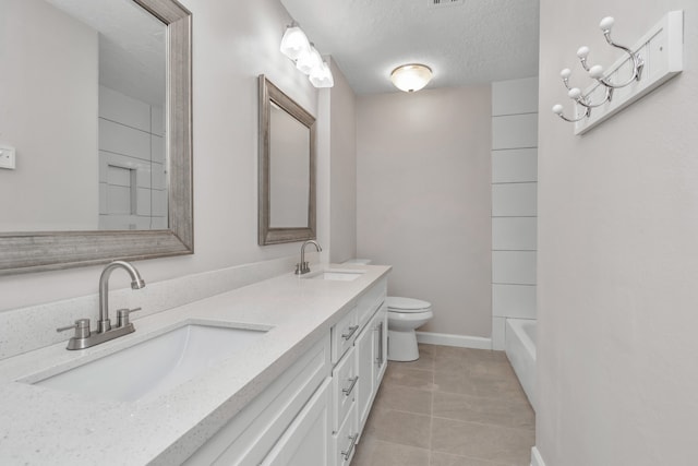 full bathroom featuring tile patterned flooring, tub / shower combination, a textured ceiling, dual bowl vanity, and toilet