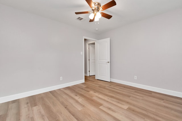 spare room featuring light hardwood / wood-style flooring and ceiling fan