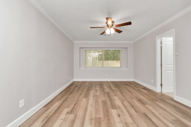 spare room with crown molding, light wood-type flooring, and ceiling fan