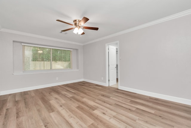 unfurnished room with ornamental molding, light hardwood / wood-style flooring, and ceiling fan