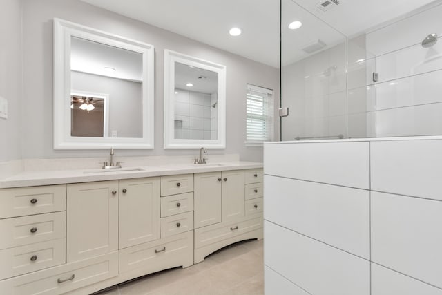 bathroom with dual vanity and tile patterned floors