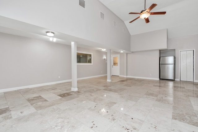 unfurnished living room featuring light tile patterned flooring, high vaulted ceiling, and ceiling fan