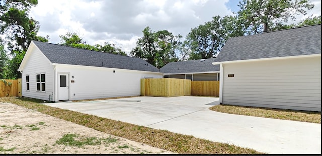 view of side of property featuring a patio