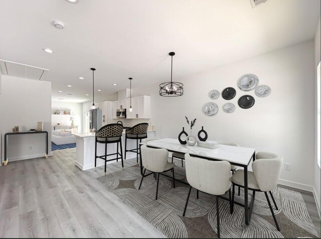 dining room with light wood-type flooring