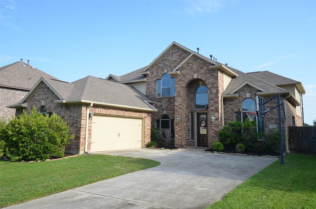 view of front of home featuring a front yard and a garage