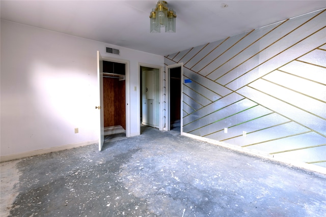 unfurnished bedroom featuring concrete floors