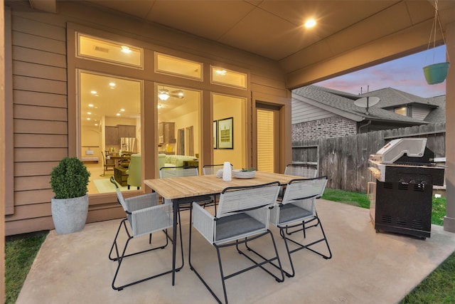 view of patio terrace at dusk