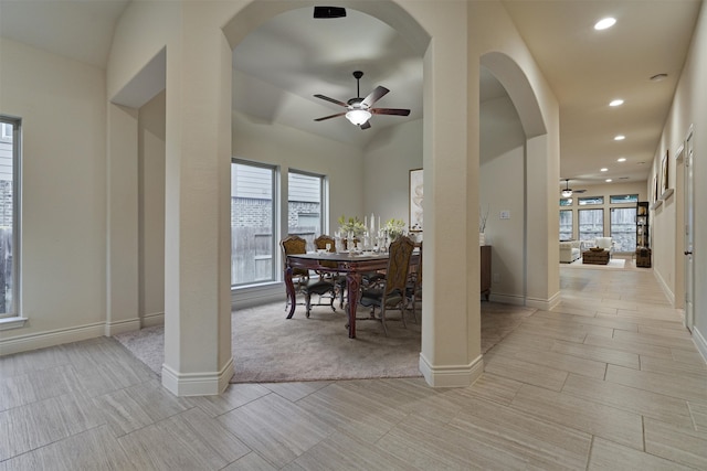 dining area featuring light tile patterned flooring, a healthy amount of sunlight, and ceiling fan