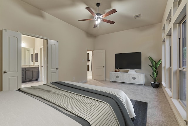 bedroom with ceiling fan and light colored carpet