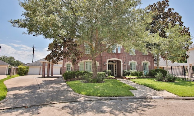 view of front of home with a garage and a front yard