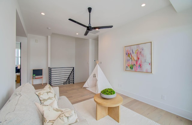 playroom featuring ceiling fan and light wood-type flooring