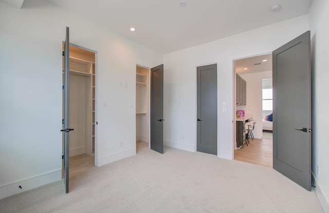 bedroom featuring light carpet