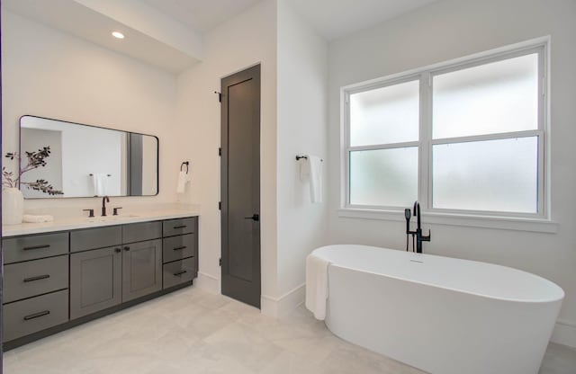 bathroom with a bathtub and vanity