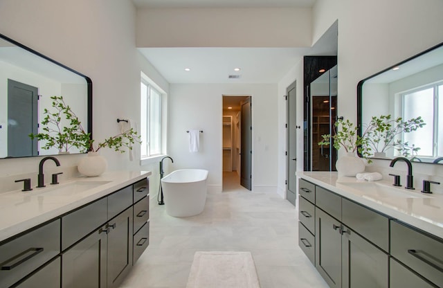 bathroom with a bathing tub and vanity