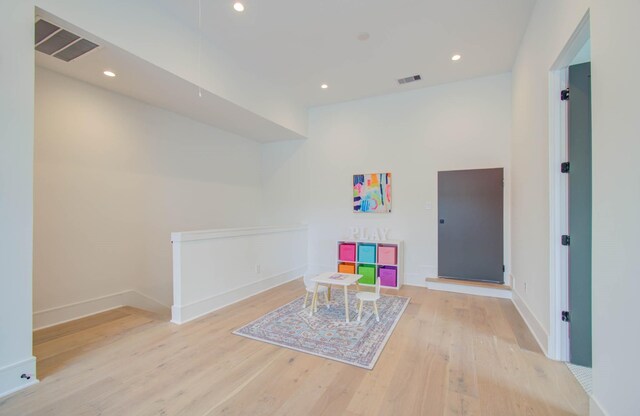 playroom featuring light wood-type flooring