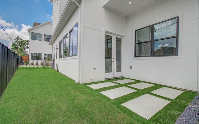 view of yard featuring french doors