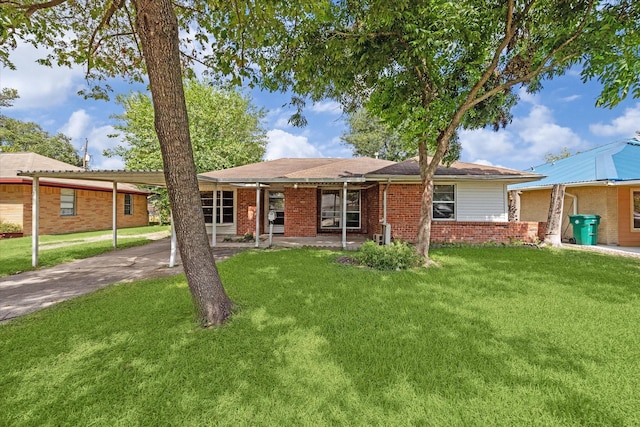 single story home featuring a carport and a front yard