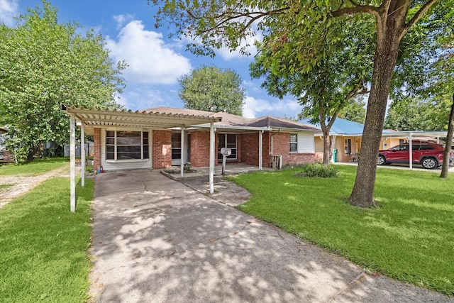 ranch-style home with a front lawn and a carport