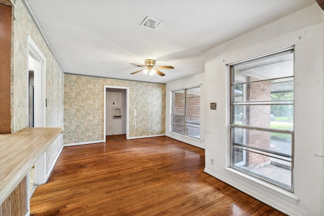 unfurnished room with ceiling fan and dark hardwood / wood-style floors