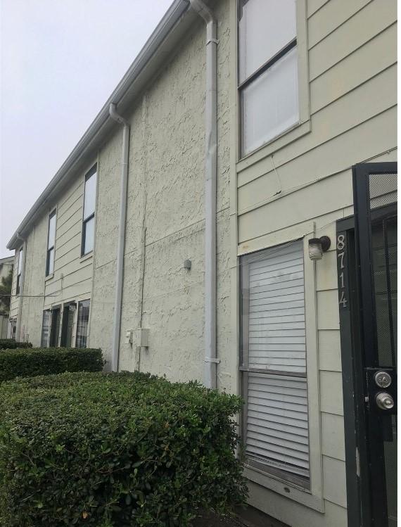 8714 Village Of Fondren Dr, Houston, TX 77071 - view of side of property with stucco siding