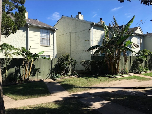 view of home's exterior with a yard