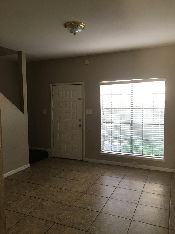 entrance foyer featuring tile patterned floors