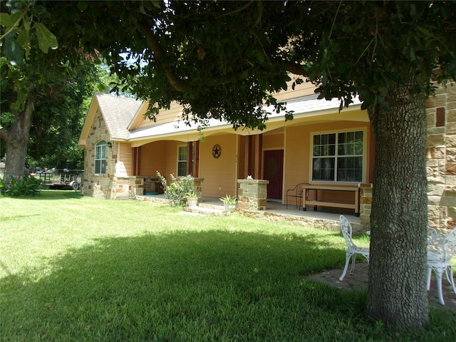 back of house with a yard