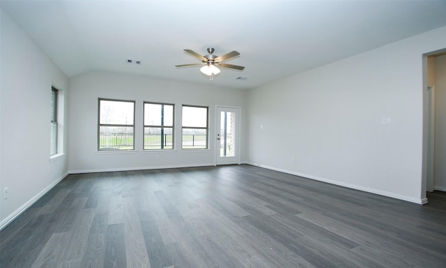 spare room featuring vaulted ceiling, dark hardwood / wood-style floors, and ceiling fan