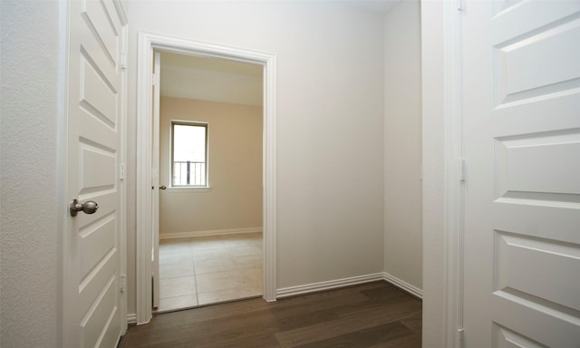 corridor featuring dark hardwood / wood-style flooring