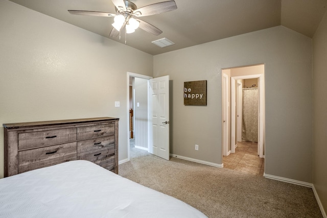 bedroom with lofted ceiling, light colored carpet, and ceiling fan