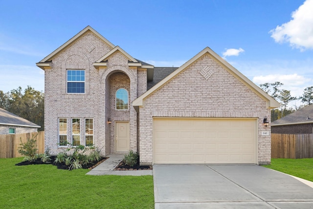 view of front property with a garage and a front yard