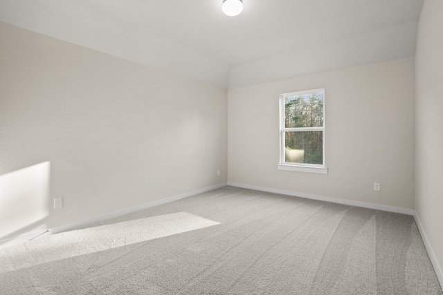 spare room with light carpet