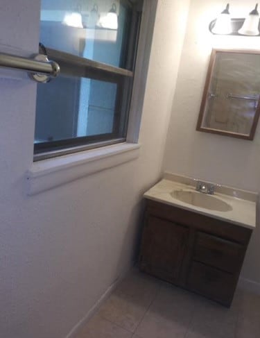 bathroom featuring vanity and tile patterned floors