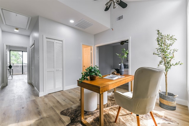 office space with ceiling fan and light hardwood / wood-style floors