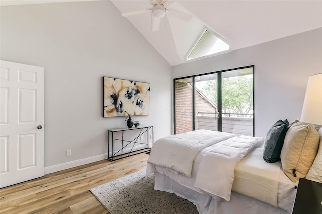 bedroom with light hardwood / wood-style flooring, access to exterior, high vaulted ceiling, and ceiling fan