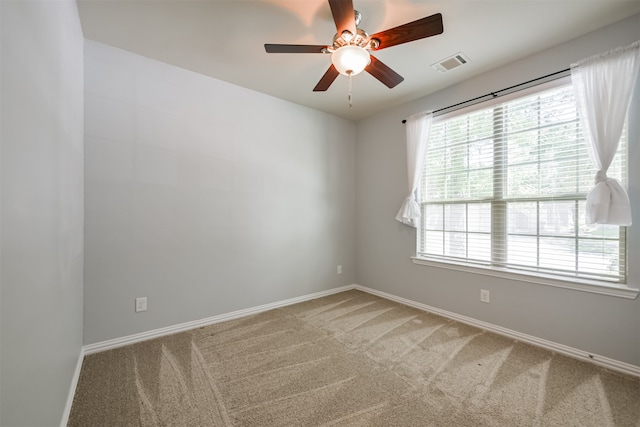 carpeted empty room with ceiling fan