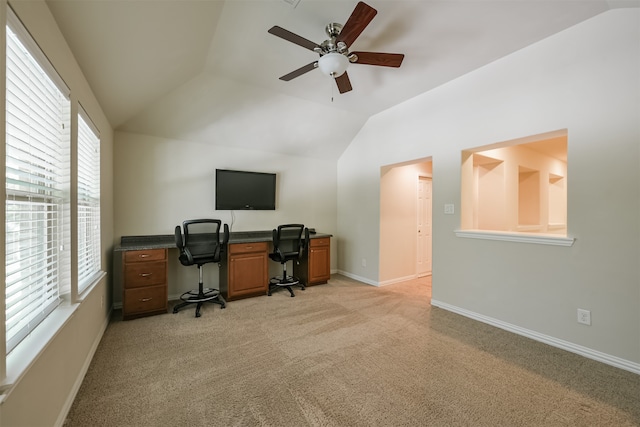 carpeted office space with lofted ceiling and ceiling fan